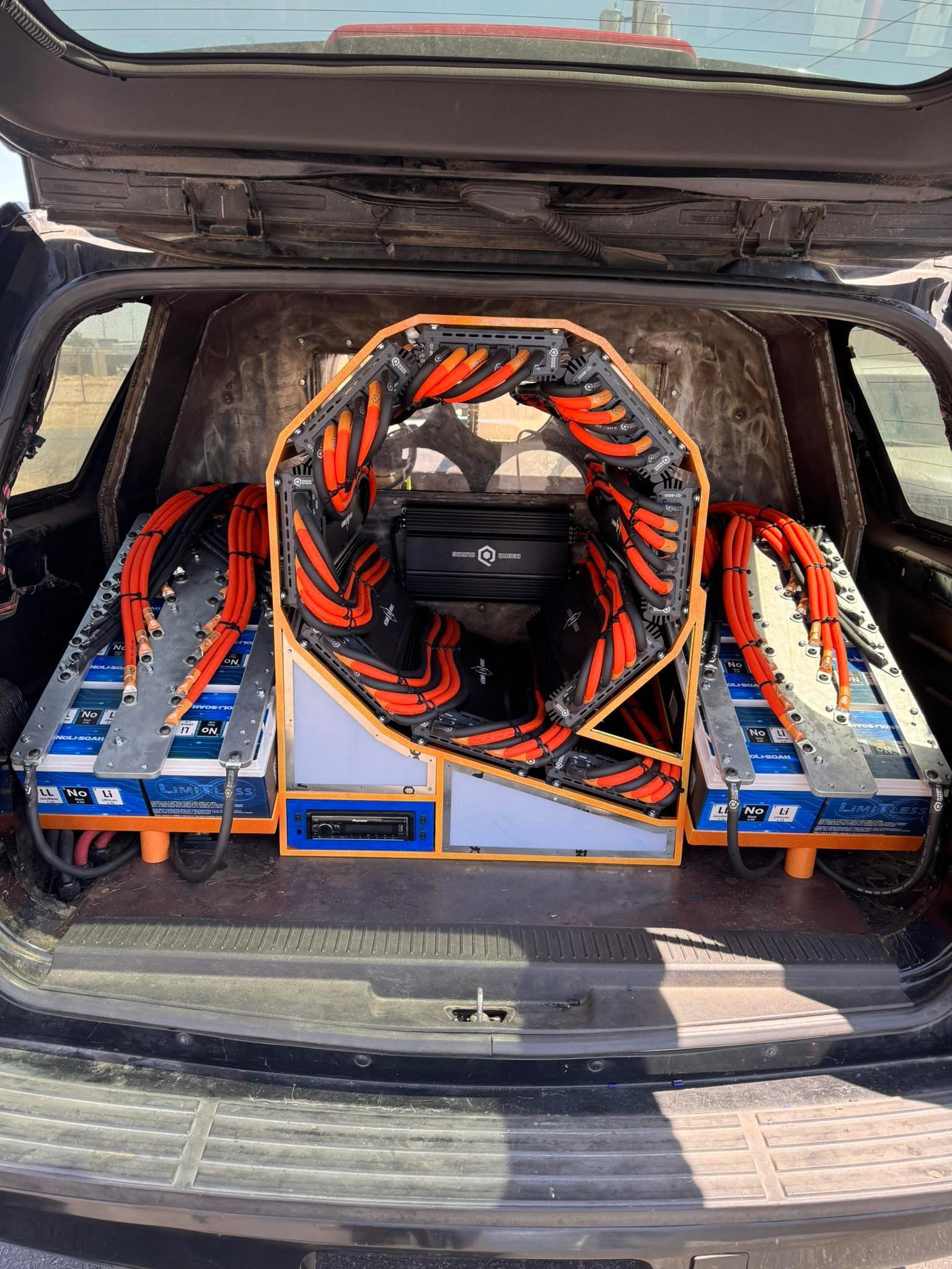 Full rear audio installation with amplifier rack and battery banks
