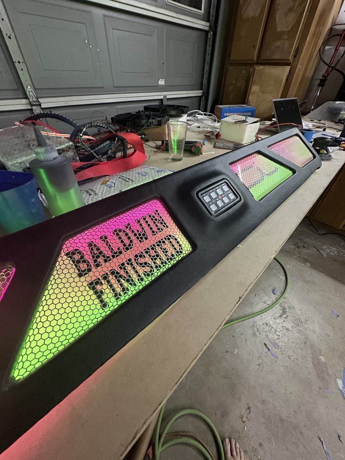 Custom fabricated trim with pink accents and illuminated mesh