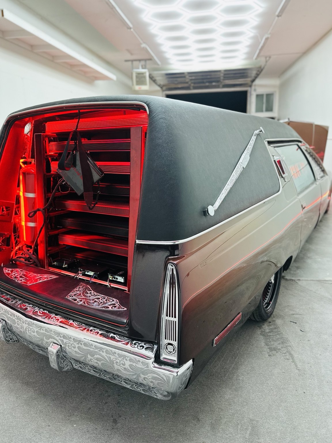 Rear view of a vehicle with a custom audio installation in progress